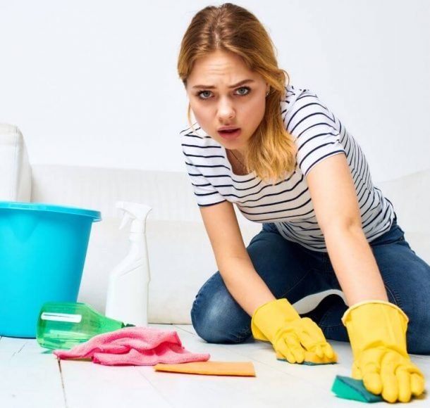 Woman cleaning floor on home Orchid Cleaning Services