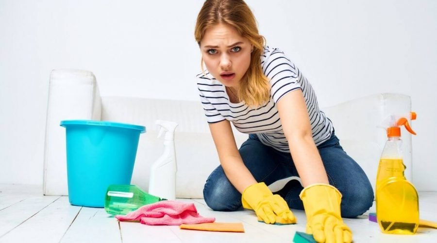 Woman cleaning floor on home Orchid Cleaning Services