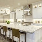 Kitchen with marble kitchen countertop in the center Orchid Cleaning Services