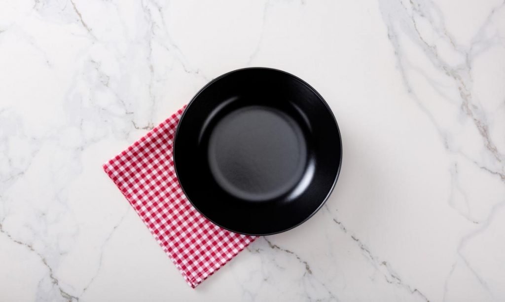 Marble kitchen countertop with a black dish Orchid Cleaning Services